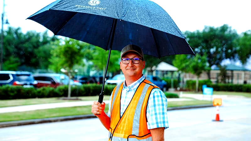 Adults meeting before service reviewing volunteer assignments